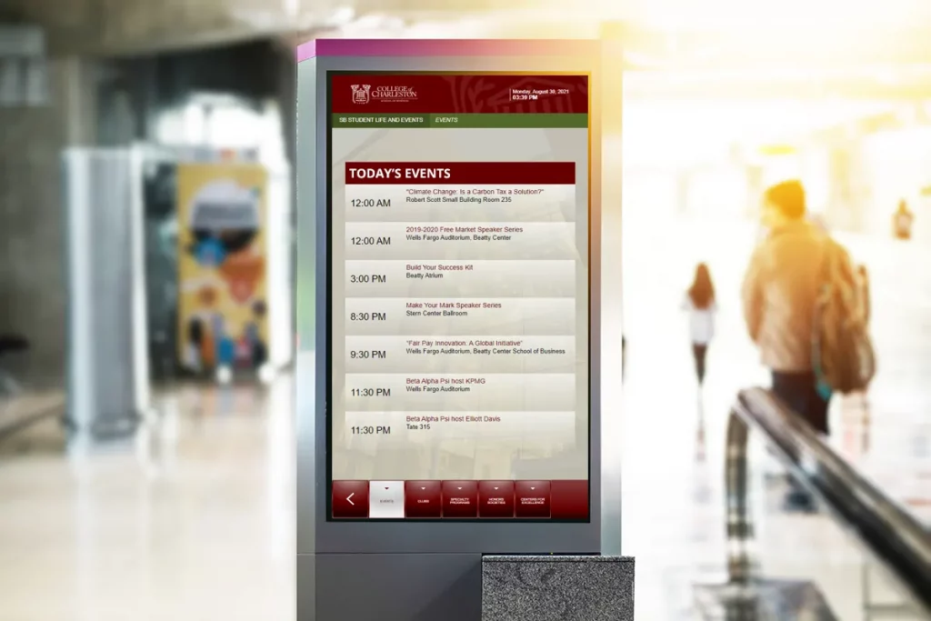 Large digital screen on a university campus.