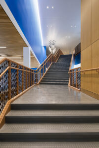 The school’s signature color plays a defining role, particularly throughout the interiors and furnishings.