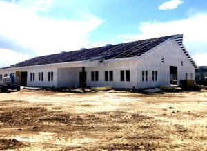 Exterior shot of building under construction.