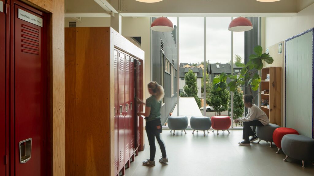 Each school has its own entry sequence, circulation patterns and clustered academic spaces, while shared program areas are located at the center of the building.
