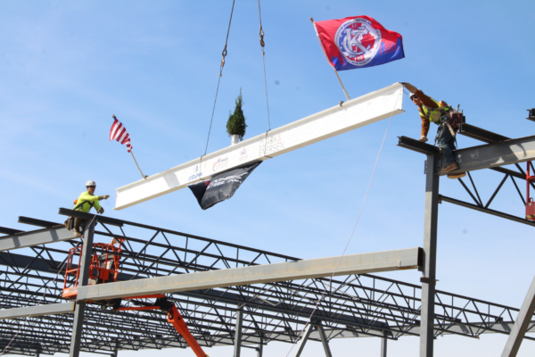 Construction has reached a key milestone on the Northland Workforce Development Center, as JE Dunn Construction and project partners recently celebrated the topping out of the new facility.