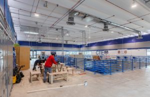 At Sheridan High School, the design team revitalized an abandoned pool building into a trades skills workshop where students could work alongside trade professionals to develop hands-on skills in carpentry, plumbing, electrical and HVAC systems.