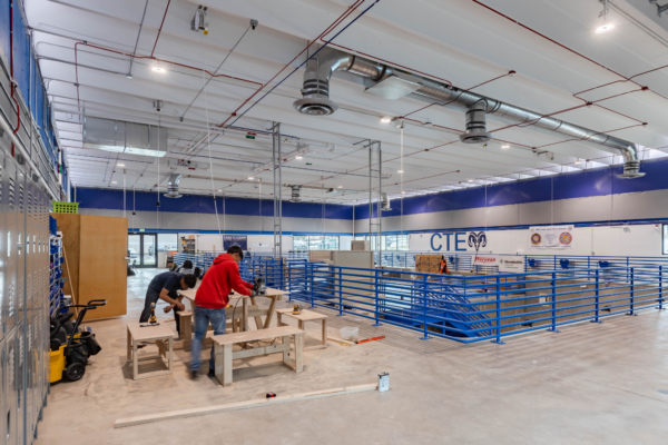 At Sheridan High School, the design team revitalized an abandoned pool building into a trades skills workshop where students could work alongside trade professionals to develop hands-on skills in carpentry, plumbing, electrical and HVAC systems.