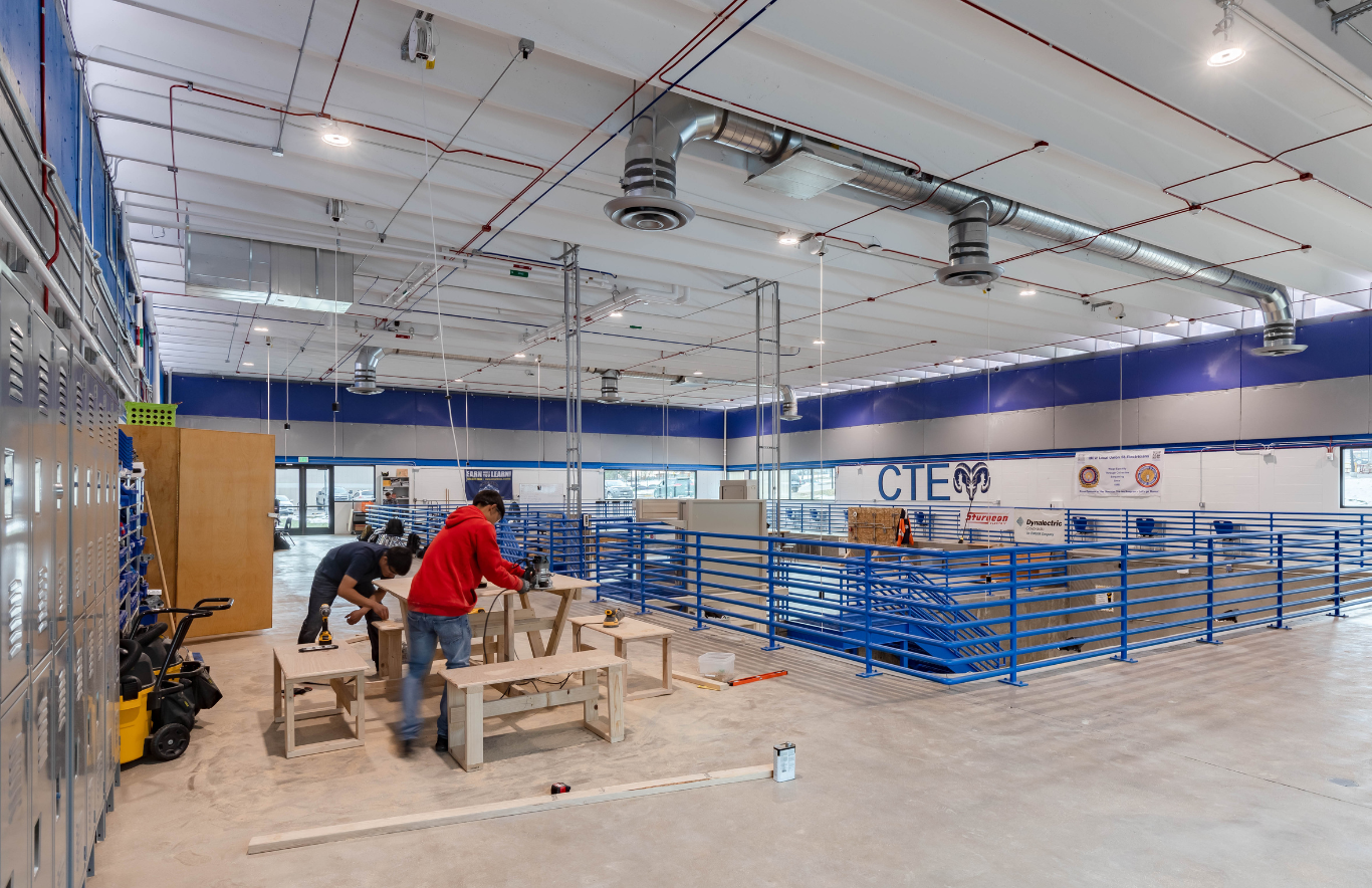 At Sheridan High School, the design team revitalized an abandoned pool building into a trades skills workshop where students could work alongside trade professionals to develop hands-on skills in carpentry, plumbing, electrical and HVAC systems.