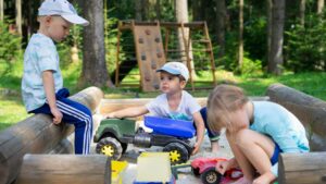 Sand and water tables, seated spinning equipment and rolling slides naturally encourage turn-taking and teamwork. | Photo Credit: Alexandr Podvalny