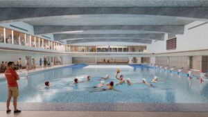 Generous glazing on the interior walls overlooking the natatorium and gym pull natural light into the large volumes whilesupporting a sense of community and shared experiences.