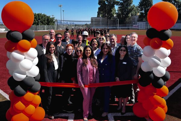 School leaders and project partners gather for the official ribbon-cutting ceremony of the new Upper Athletic Fields at Beverly Hills High School.